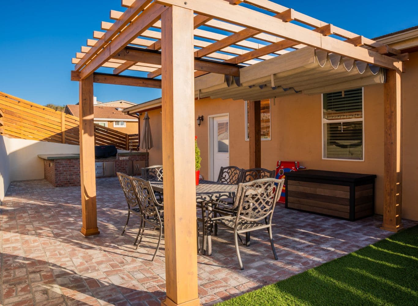 Backyard remodel with artificial turf, pavers and patio cover